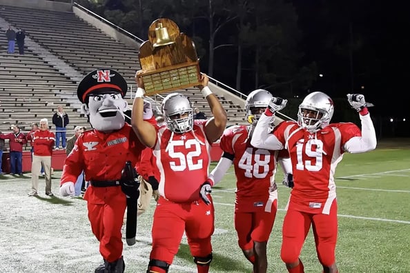 Charles McDade with the River Bell trophy after Nicholls State defeated Southeastern Louisiana 30 to 14 on November 18, 2010