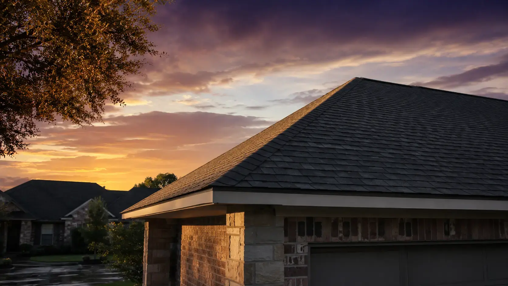 New architectural shingle roof on a Houston area home under a clear evening sky