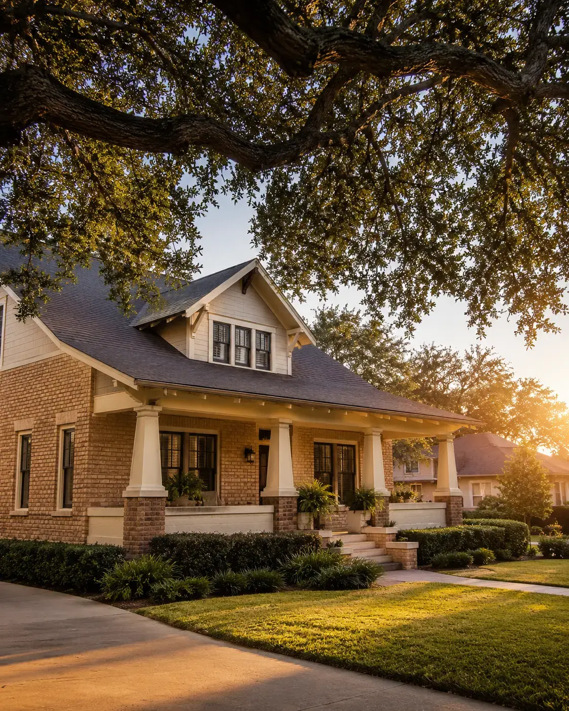 A brick Bryan College Station home with live oak shade and warm Brazos Valley golden hour light